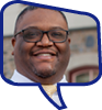 Headshot of Austin Duckett in a blue speech bubble