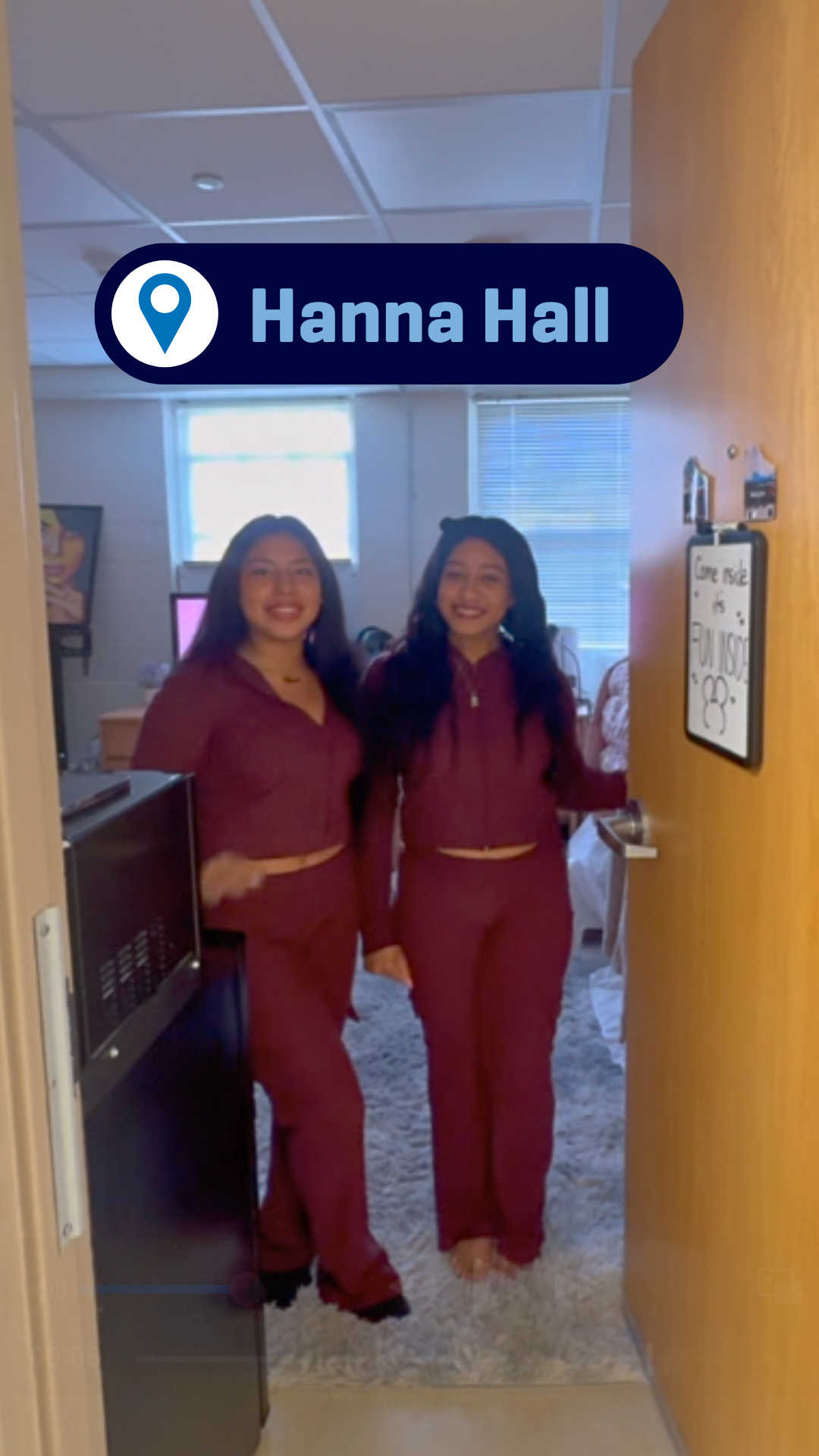 Two students giving a tour of their room in Hanna Hall.