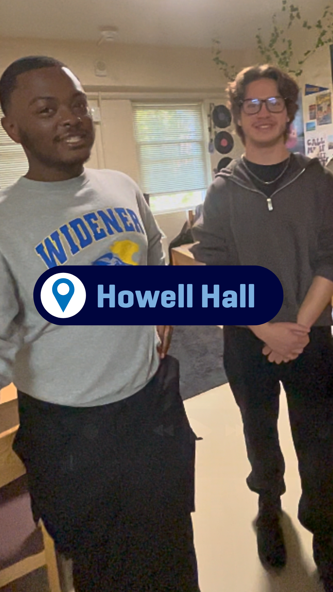Two students giving a tour of their room in Howell Hall.