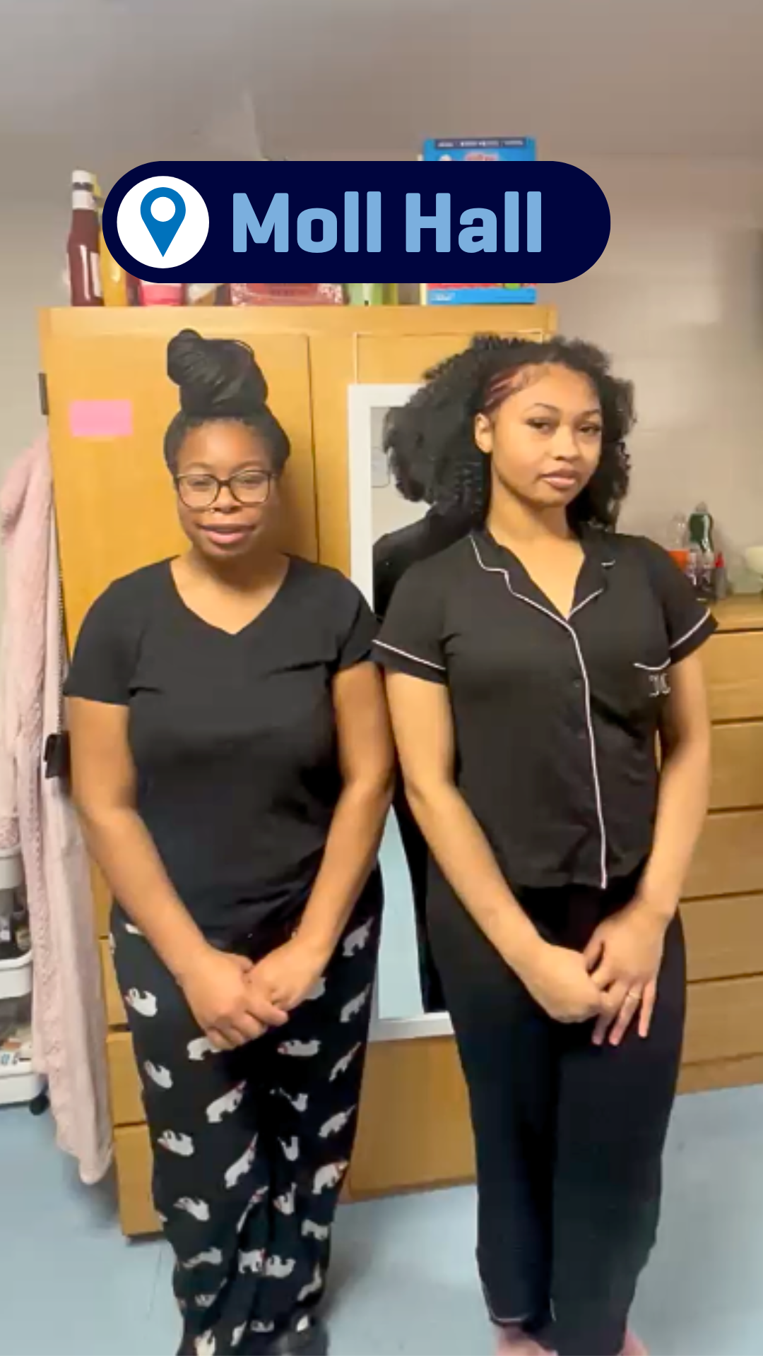 Two students giving a room tour of their room in Moll Hall.