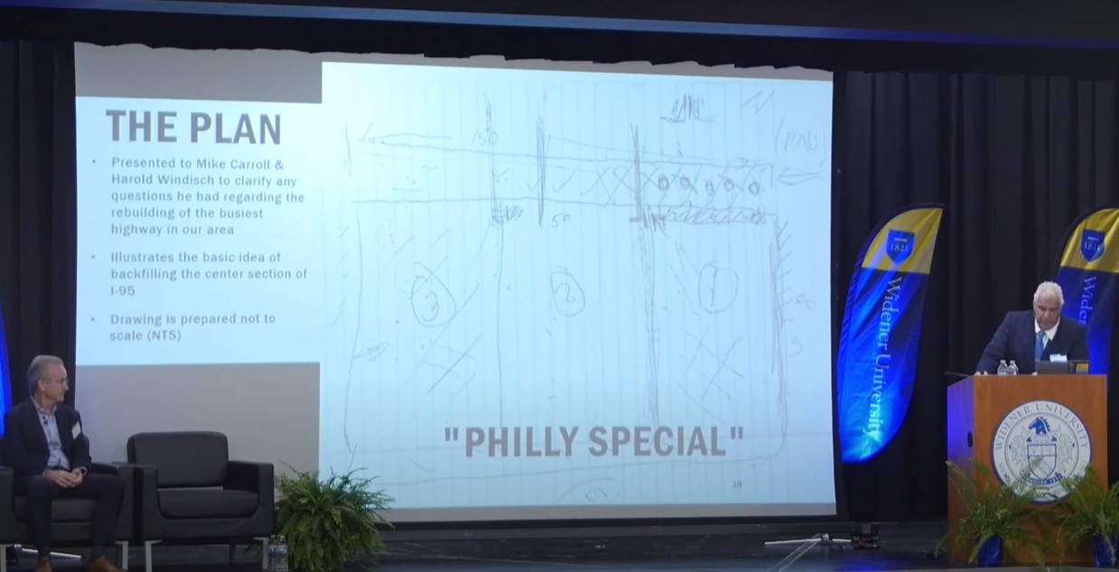 Buckley on stage presenting "Rebuilding I-95: Twelve Days in June"