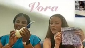 Kayla and Laurel holding a Vora device
