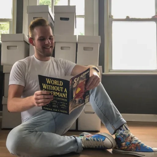 Student Evan Davis reading a Superman comic book