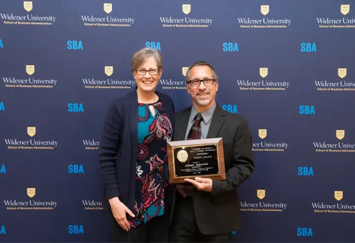 Robin Dole and her husband, Joe Gelormini, pose for a photo following Joe winning an award.
