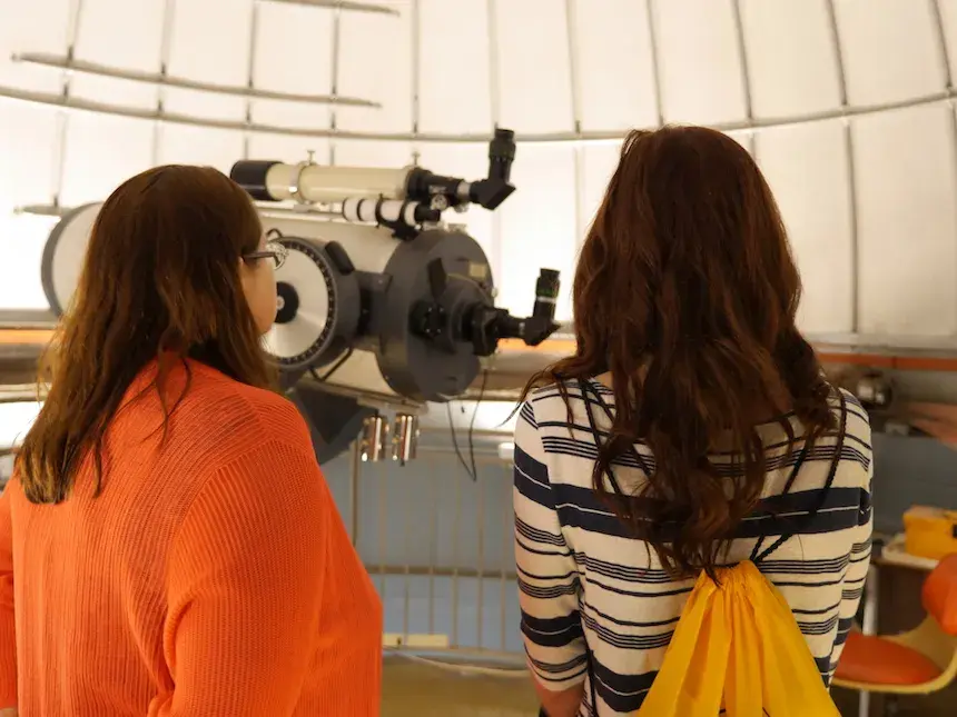 Faculty and student at telescope