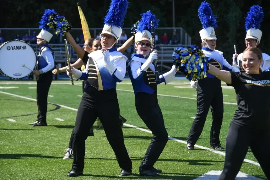 Two band students perform at halftime.