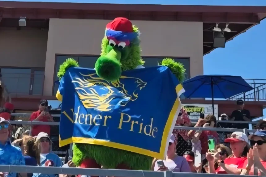 The Phillie Phanatic poses with a "Widener Pride" flag