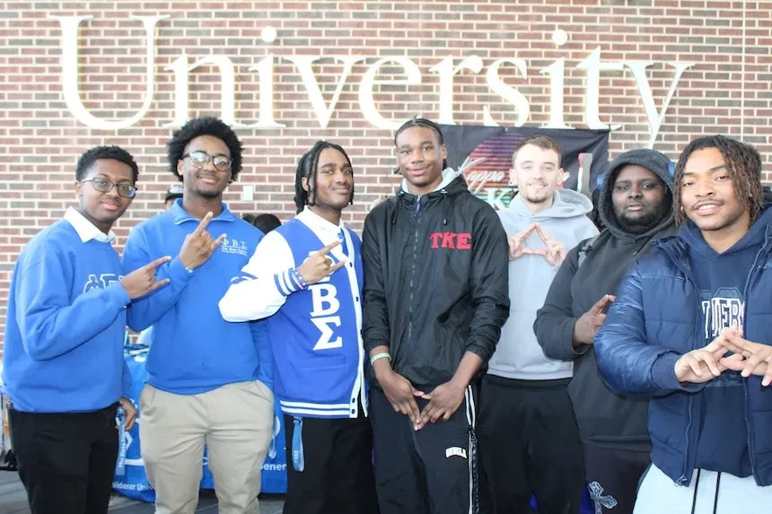 TKE and PBS fraternity members pose together.