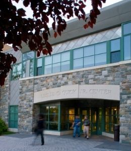 People walk in front of the Quick Center building