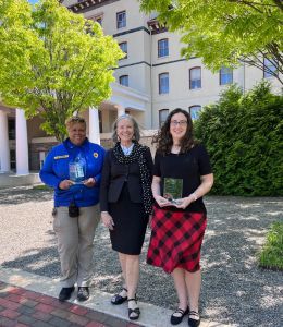 Lt. Vontel Green, President Stacey Robertson and Erica Austin standing outdoors.