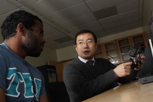 Robotics engineering professor advising a student on pathways in the robotics program.