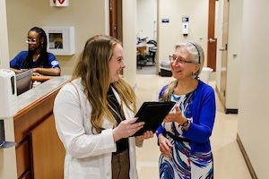 widener school of nursing graduate student in lab coat mentored by faculty near philadelphia