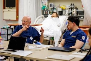 widener school of nursing faculty teaches undergraduate student in nursing simulation lab near philadelphia