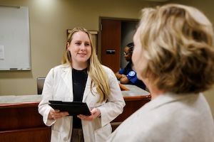 widener school of nursing graduate student discusses research with professor in health care office near philadelphia