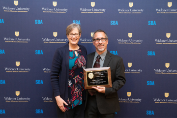 Robin Dole and her husband, Joe Gelormini, pose for a photo following Joe winning an award.