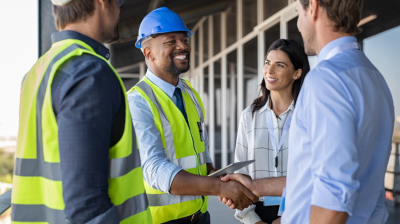 An engineer with an MBDA degree supervises at a job site