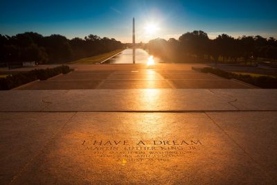 The sun sets behind the Washington monument with a view from the steps of the Lincoln Memorial where Martin Luther King Jr. gave his "I have a dream" speech.