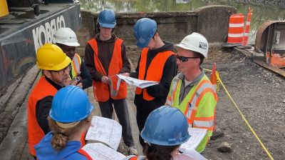 A group of Widener University construction management engineering students gaining hands-on experience at a construction site.