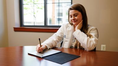 widener school of nursing graduate student in lab coat works in office near philadelphia