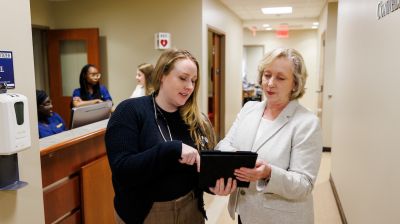 widener school of nursing graduate student speaks with faculty in health care office near philadelphia