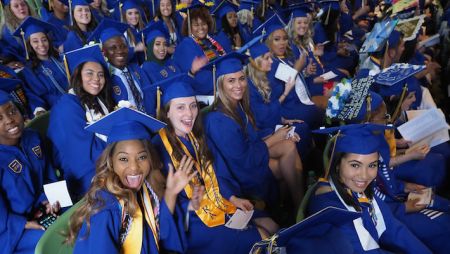 students celebrate commencement at mann center