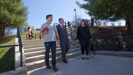 Commonwealth law student and faculty walking down stairs on campus
