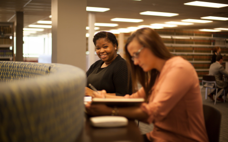 Two Cmmonwealth law students in library