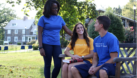 Three Delaware Law students outside on campus
