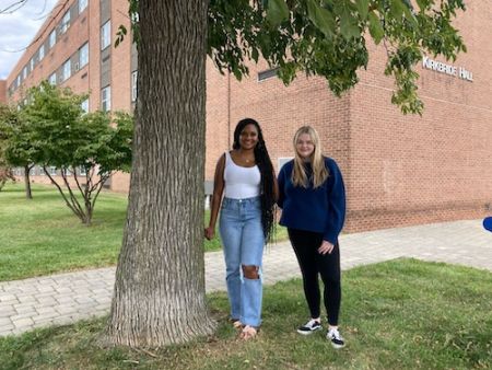 Two students stand outside of Kirkbride Hall on a Civil Rights walking tour.