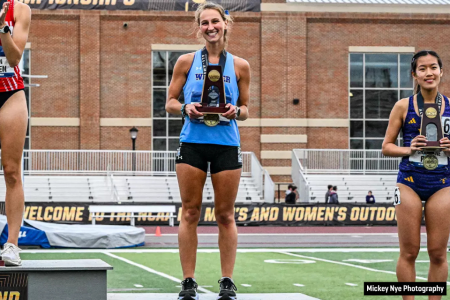 Student athlete Gabby Nye, in Widener track uniform, on a podium holding a trophy