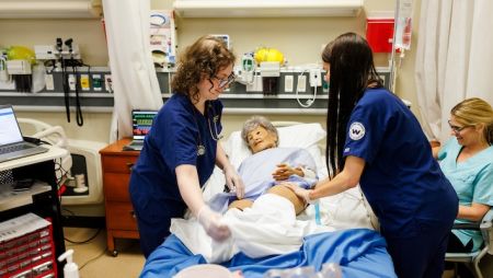 two widener nursing students work together in simulation lab near philadelphia