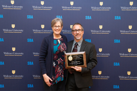 Robin Dole and her husband, Joe Gelormini, pose for a photo following Joe winning an award.