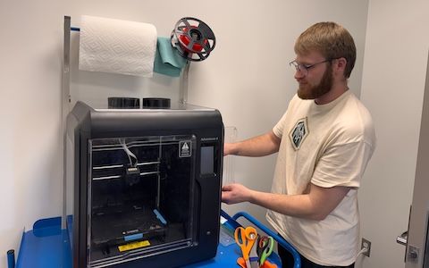OT student 3D printing an item in the Occupational Therapy Maker’s Lab