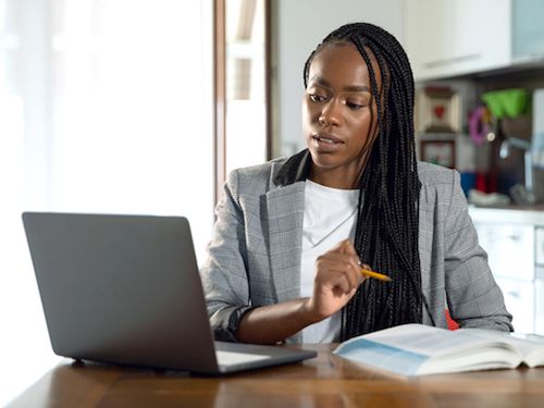 A professor teaches her class online.