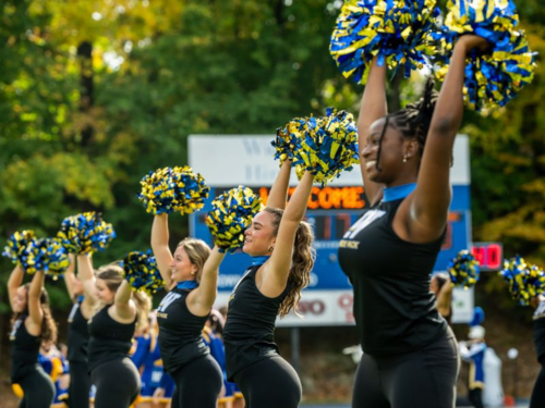 The Pride Pack dance team performs on the football field at Widener University's homecoming.