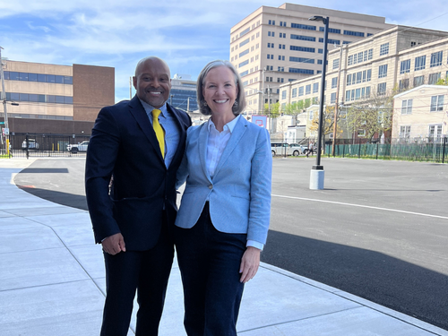 Delaware Law School Dean Todd Clark and Widener University President Stacey Robertson pose for a photo at the site of the new location for Delaware Law School in Wilmington.
