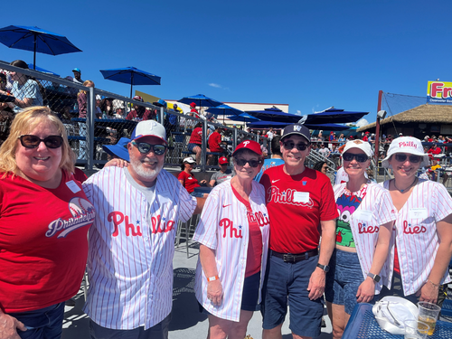 Alumni, family and friends pose for a photo from the Phillies spring training game.
