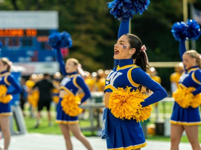 Cheerleaders perform at Homecoming.