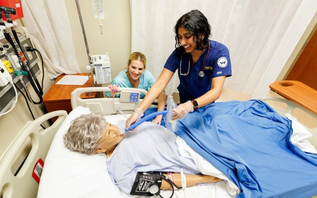 widener school of nursing undergraduate student advised by professor in simulation lab near philadelphia