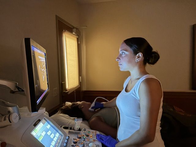Student at an ultrasound machine